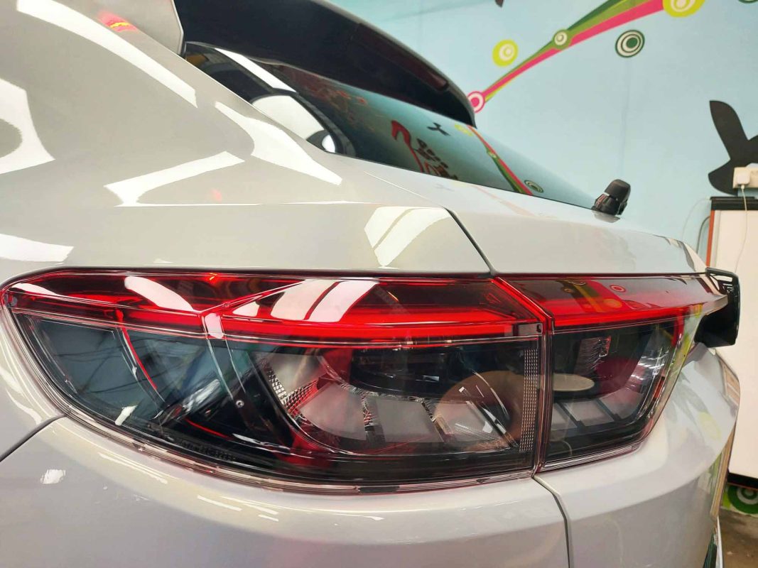 The coated bonnet of the HR-V under workshop lighting.