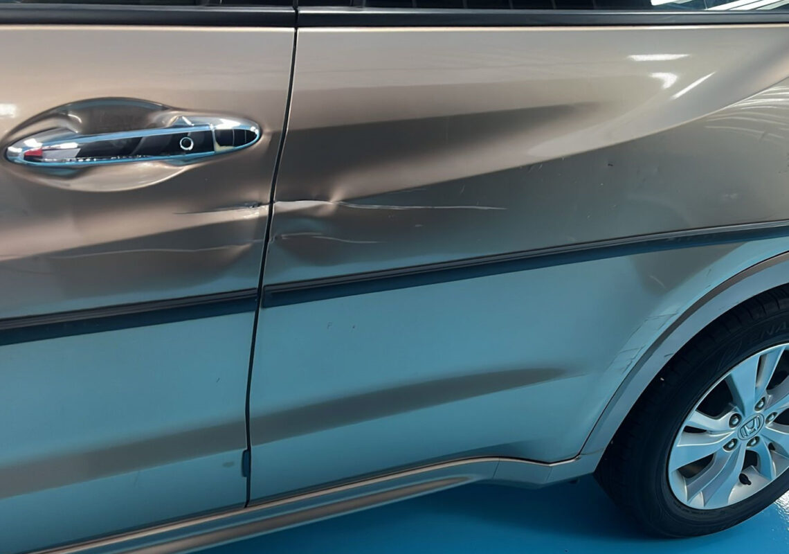 Close view of the Honda HR-V's bodywork on arrival, showing scratches and paintwork blemishes.