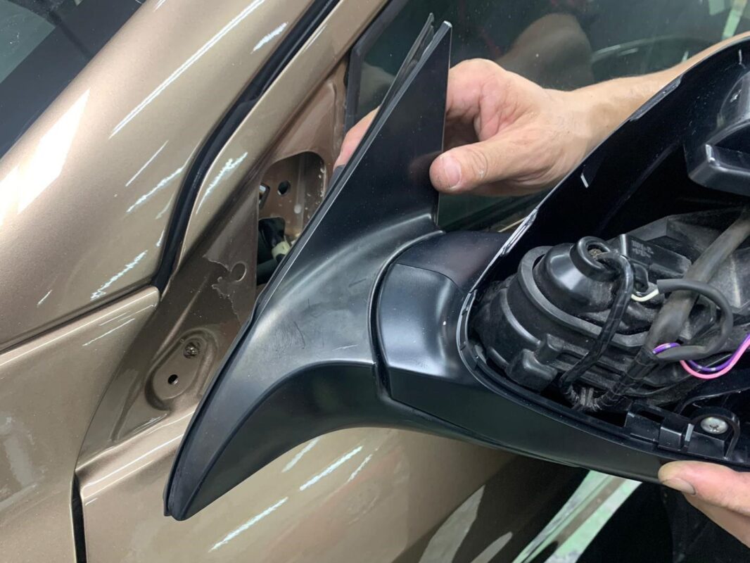 Honda HR-V in the spray booth, new coat being applied.
