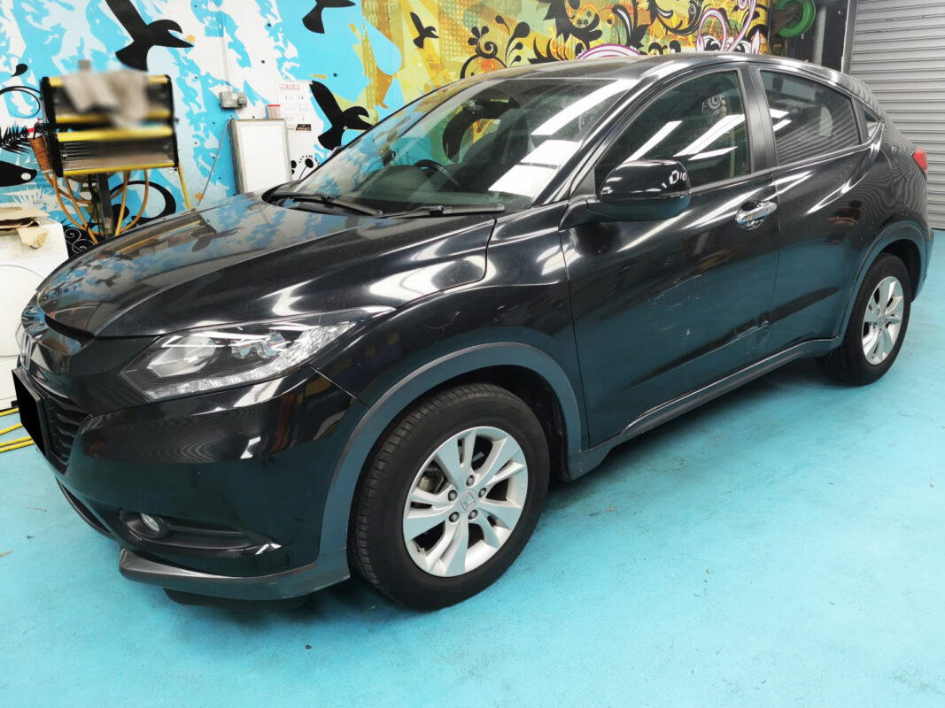 Honda HR-V as it arrived at Revol Carz, front three-quarter view showing faded and damaged paintwork.