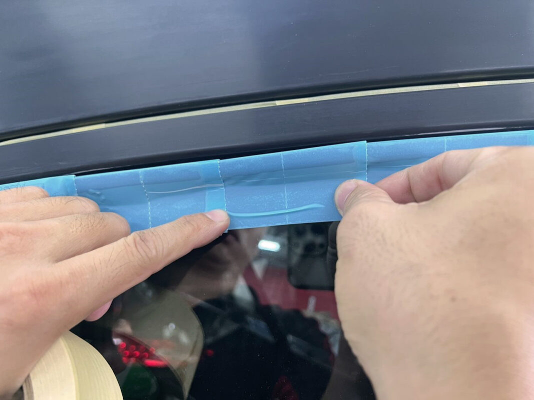 Masking the Honda HR-V, non-painted surfaces covered before entering the spray booth.