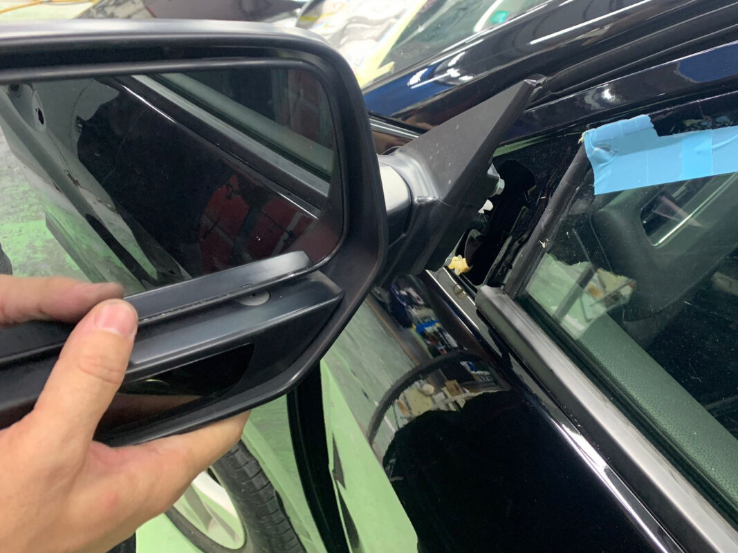 Machine-polishing the Honda HR-V's panels after painting to bring up the gloss.