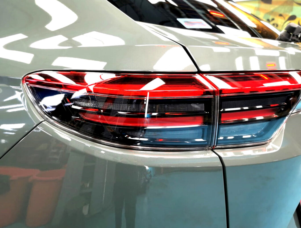 The coated bonnet of the Honda HR-V under workshop lighting.