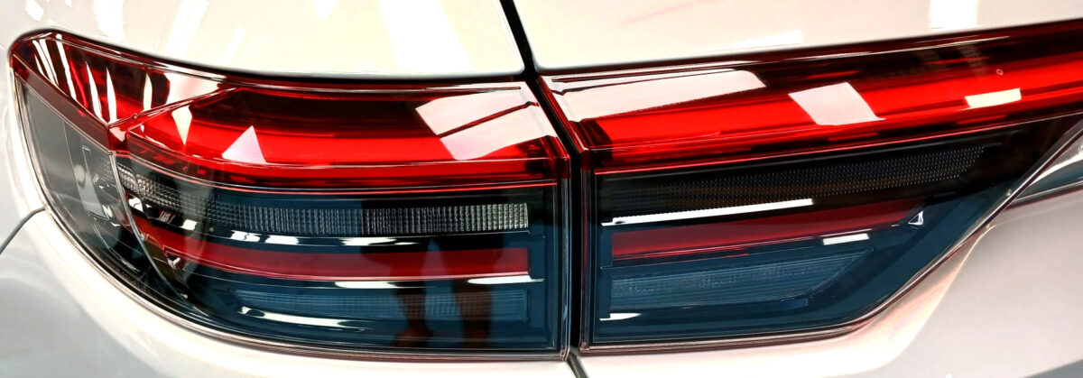 The coated bonnet of the Honda HR-V under workshop lighting.