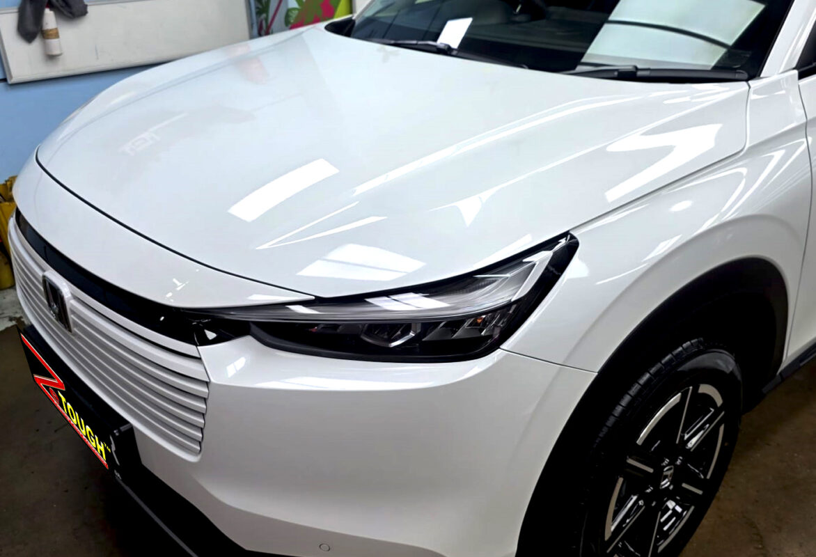 The Honda HR-V's coated paintwork under workshop lighting.