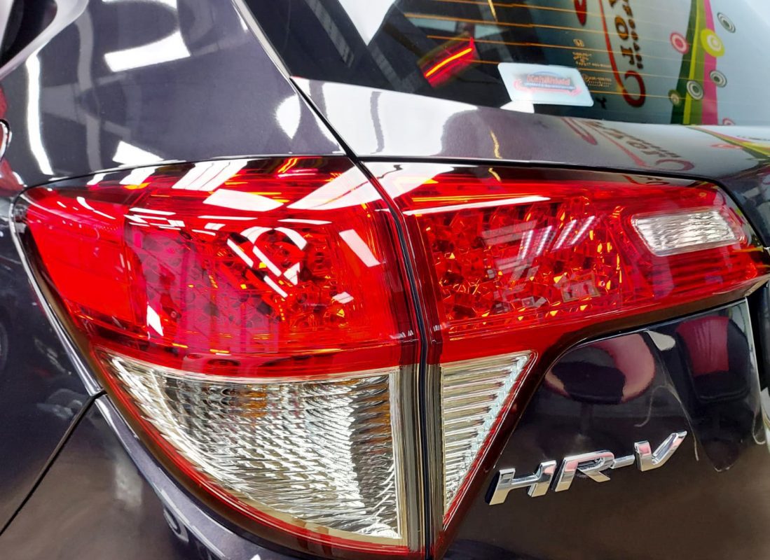 The coated bonnet of the Honda HR-V under workshop lighting.