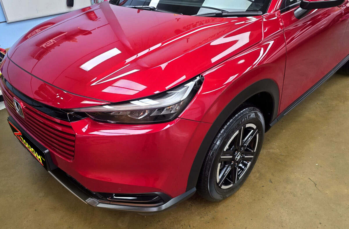 The Honda HR-V's coated paintwork under workshop lighting.