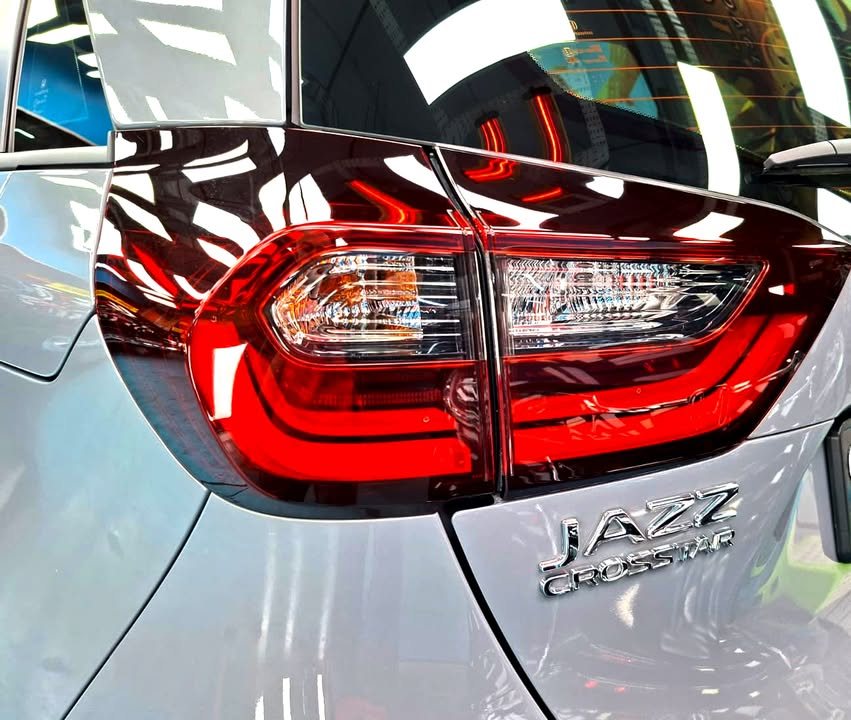 Red tail light cluster and Jazz Crosstar badge on the grey tailgate.