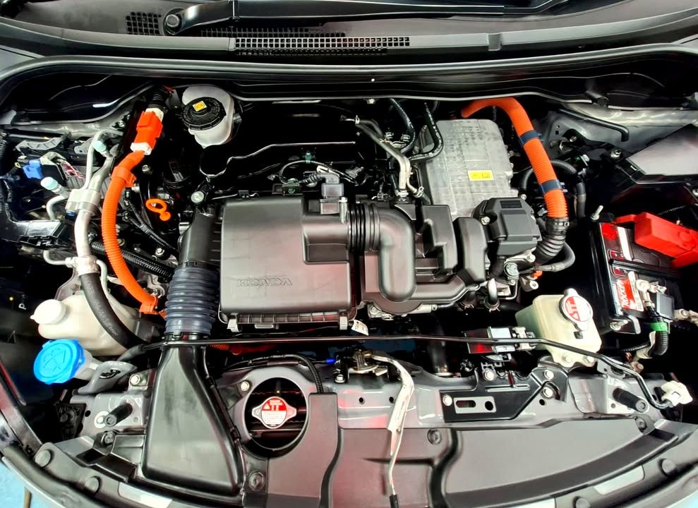 Clean engine bay with orange hybrid cables.