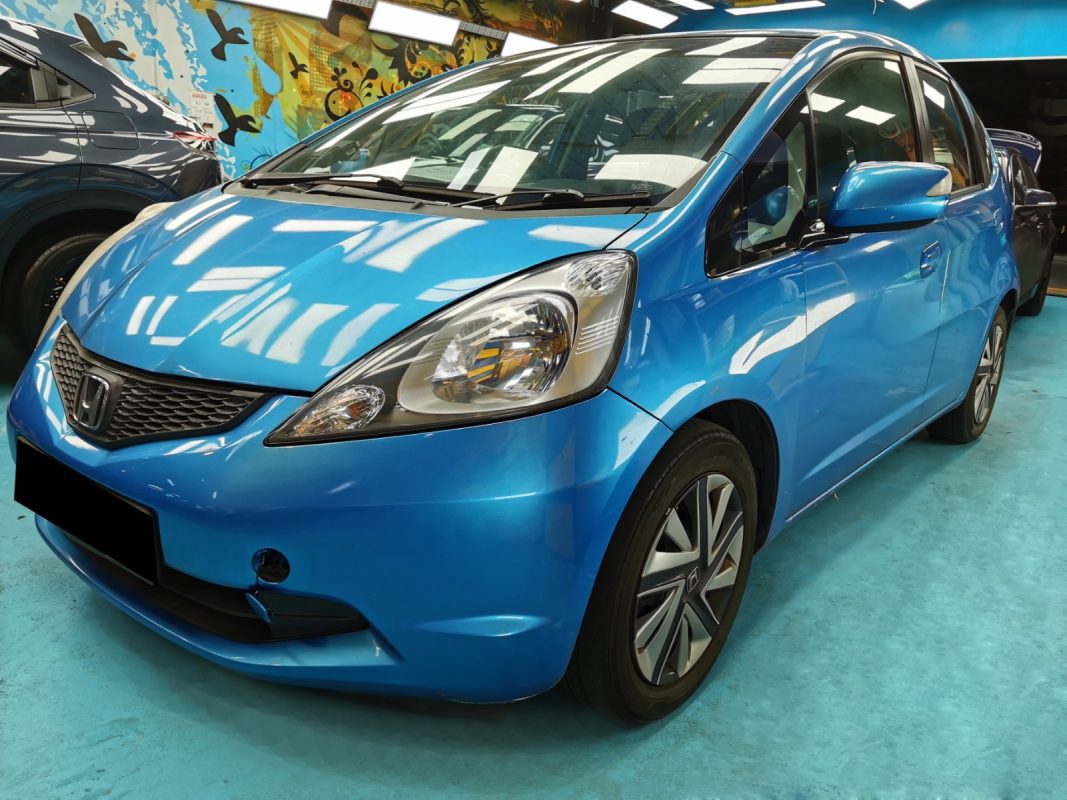 Honda Jazz as it arrived at Revol Carz before the respray, side view.