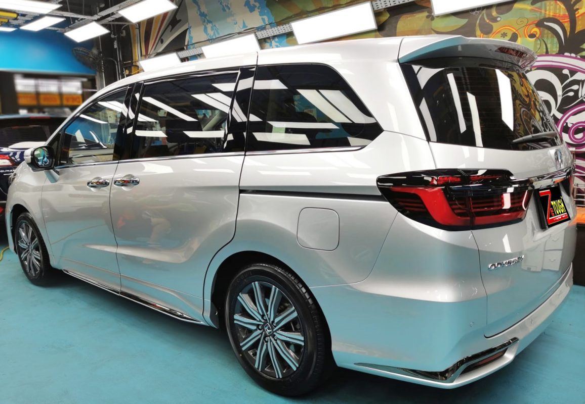 Rear quarter of the Honda Odyssey, glossy and protected.