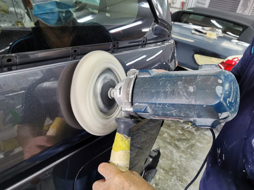 The Odyssey being sanded after spraying for an even surface.