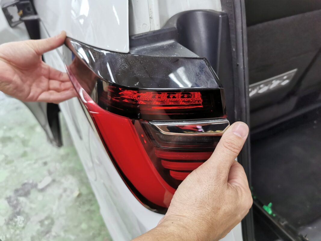 A rear tail light removed from the Honda Odyssey before spraying.