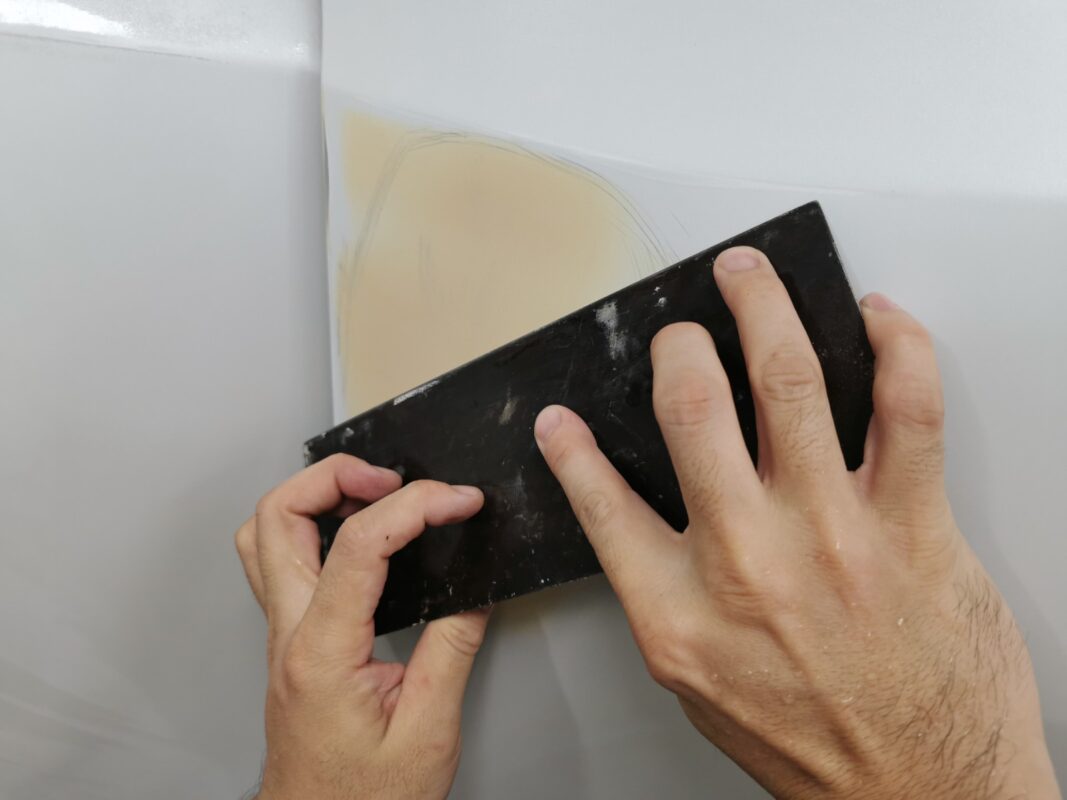 A panel on the Honda Odyssey levelled smooth with filler before paint.