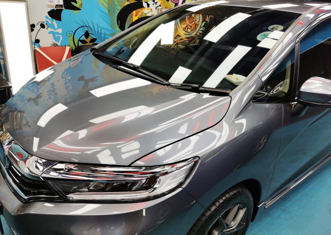 The Honda Shuttle from a side angle after the titanium coating.