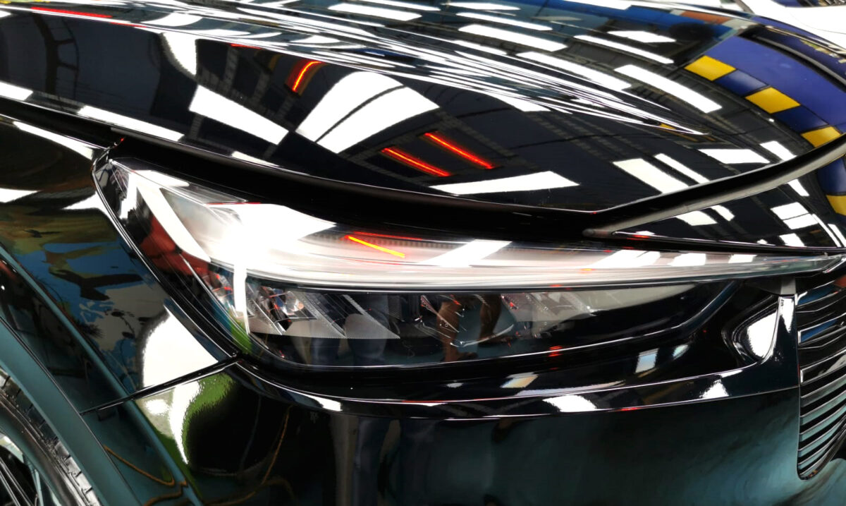 The Vezel's coated paintwork showing clean reflections.