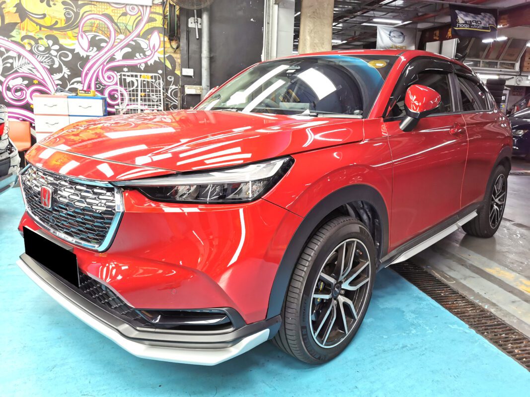 The red Honda Vezel as it arrived at Revol Carz, front three-quarter view before the respray.