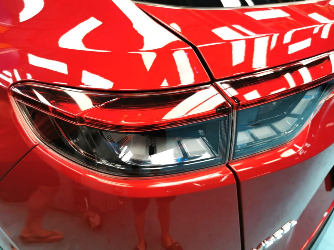 After: the same view, resprayed to a clean, glossy red.