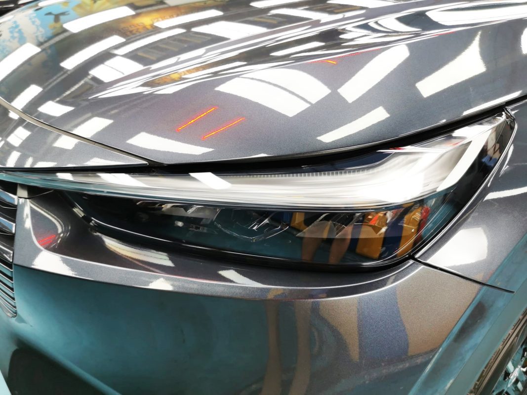 The Vezel's coated paintwork showing clean reflections.