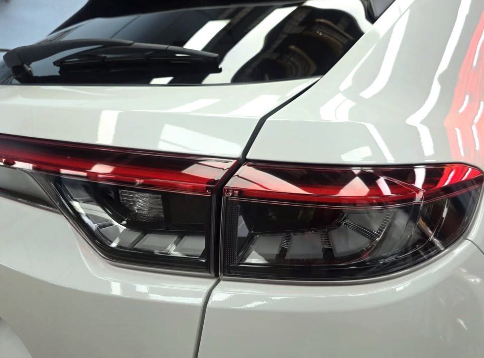 Close-up of the red tail light across the boot and rear wing.