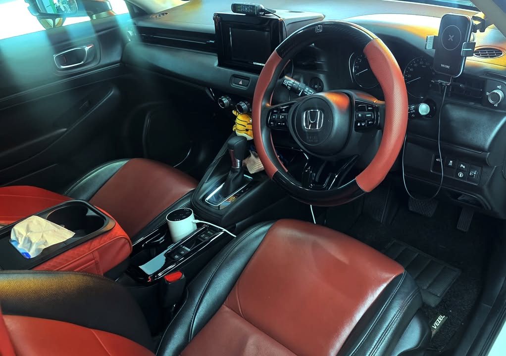 Cleaned interior with black and tan leather seats, steering wheel and centre console.