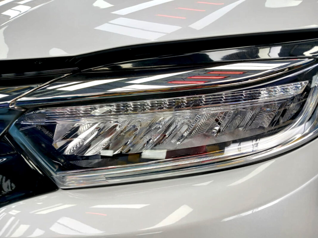 The Vezel's coated paintwork showing clean reflections.
