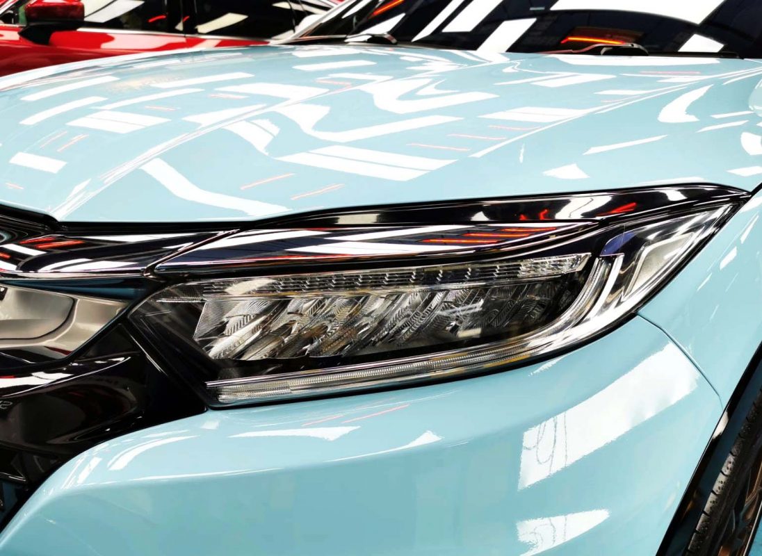 The Vezel's coated paintwork showing clean reflections.
