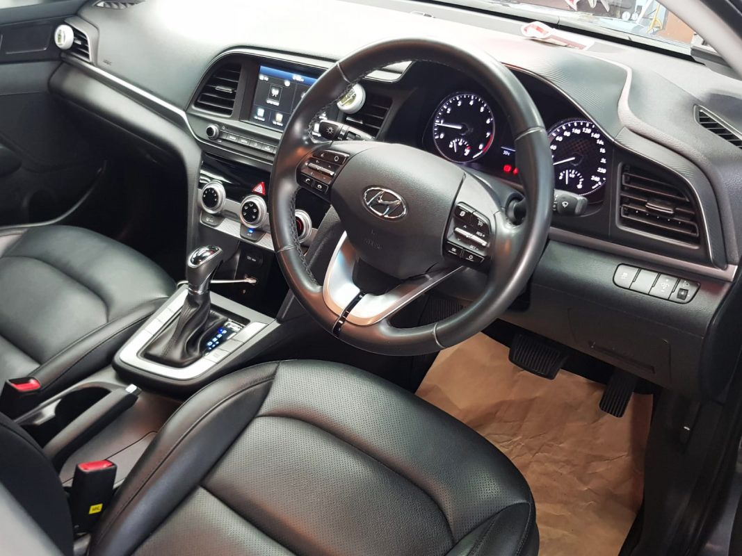 The Hyundai Avante parked in the workshop, freshly coated.