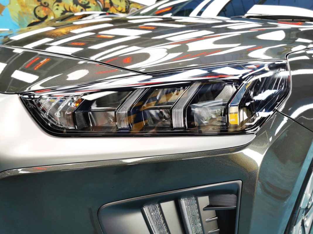 The Ioniq's coated paintwork showing clean reflections.