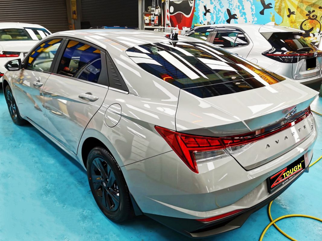 Rear quarter of the Hyundai CN7 Avante, glossy and protected.
