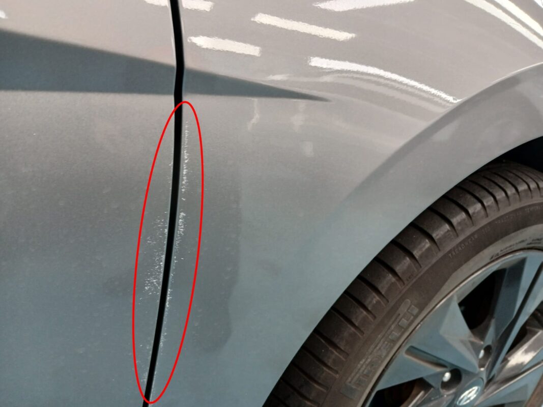 The Hyundai CN7 from another angle at intake, showing the worn paintwork.
