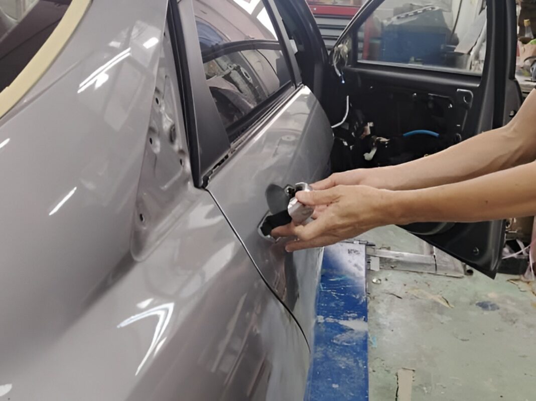 Car parts being dismantled from the Hyundai CN7 in preparation for spraying.