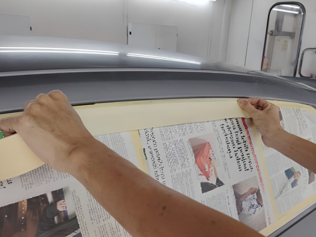 Non-painted surfaces being masked off on the Hyundai CN7.
