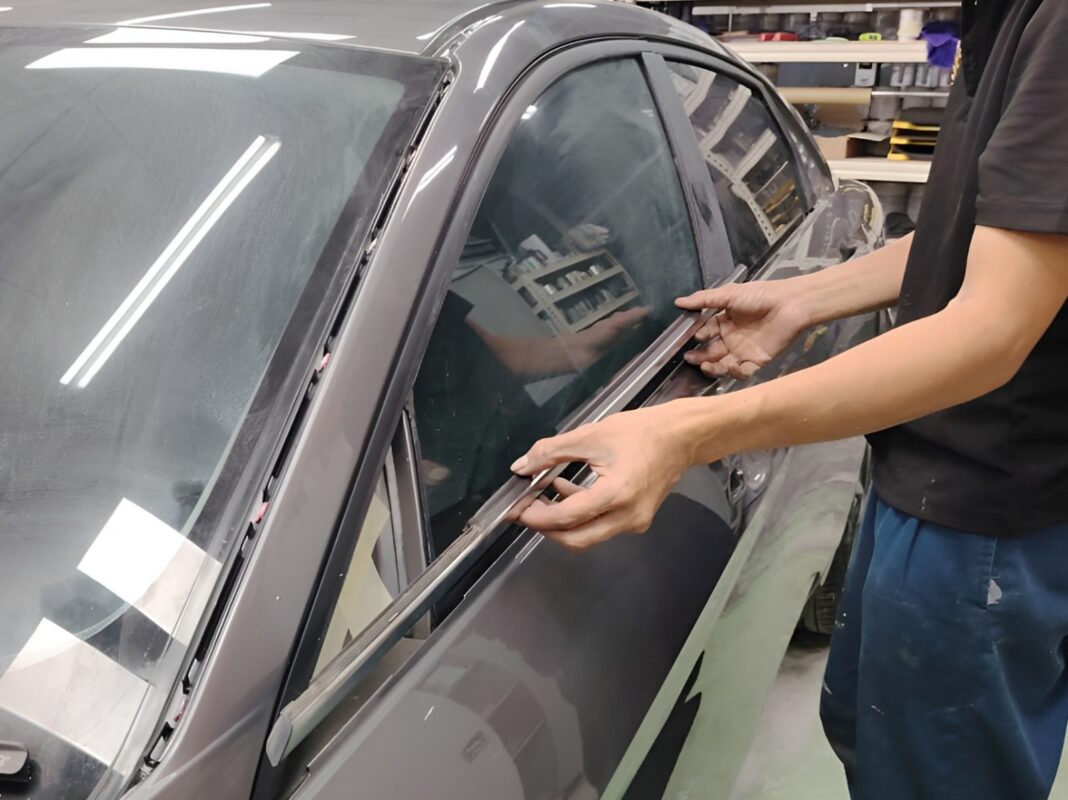 Previously removed car parts being refitted onto the Hyundai CN7.