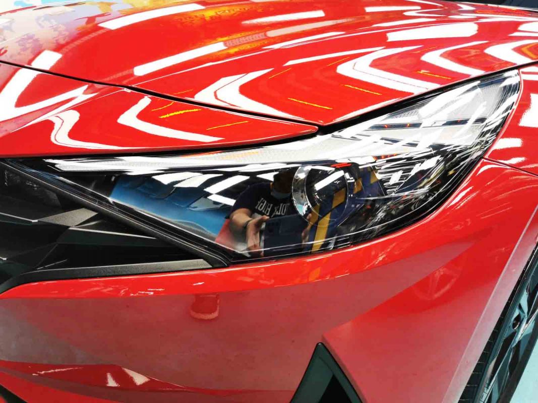 The CN7's coated paintwork showing clean reflections.