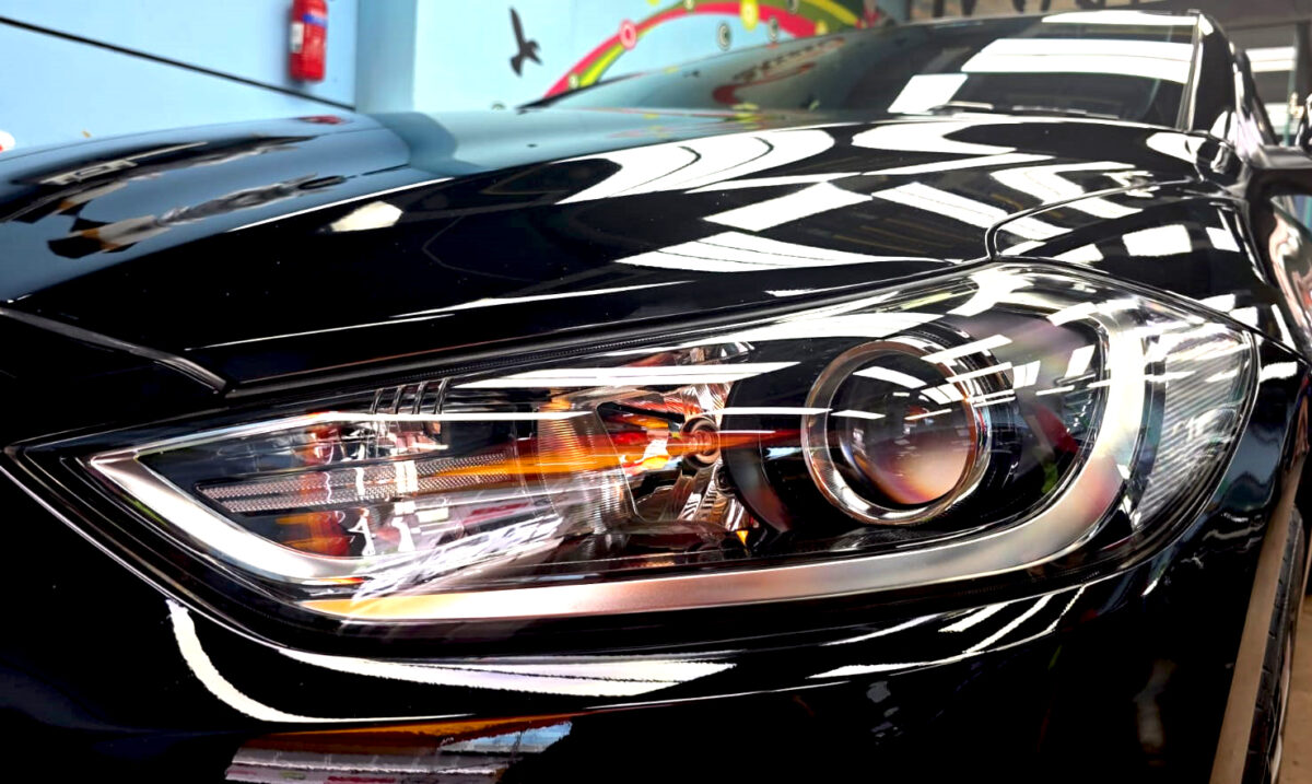 The Elantra's coated paintwork showing clean reflections.