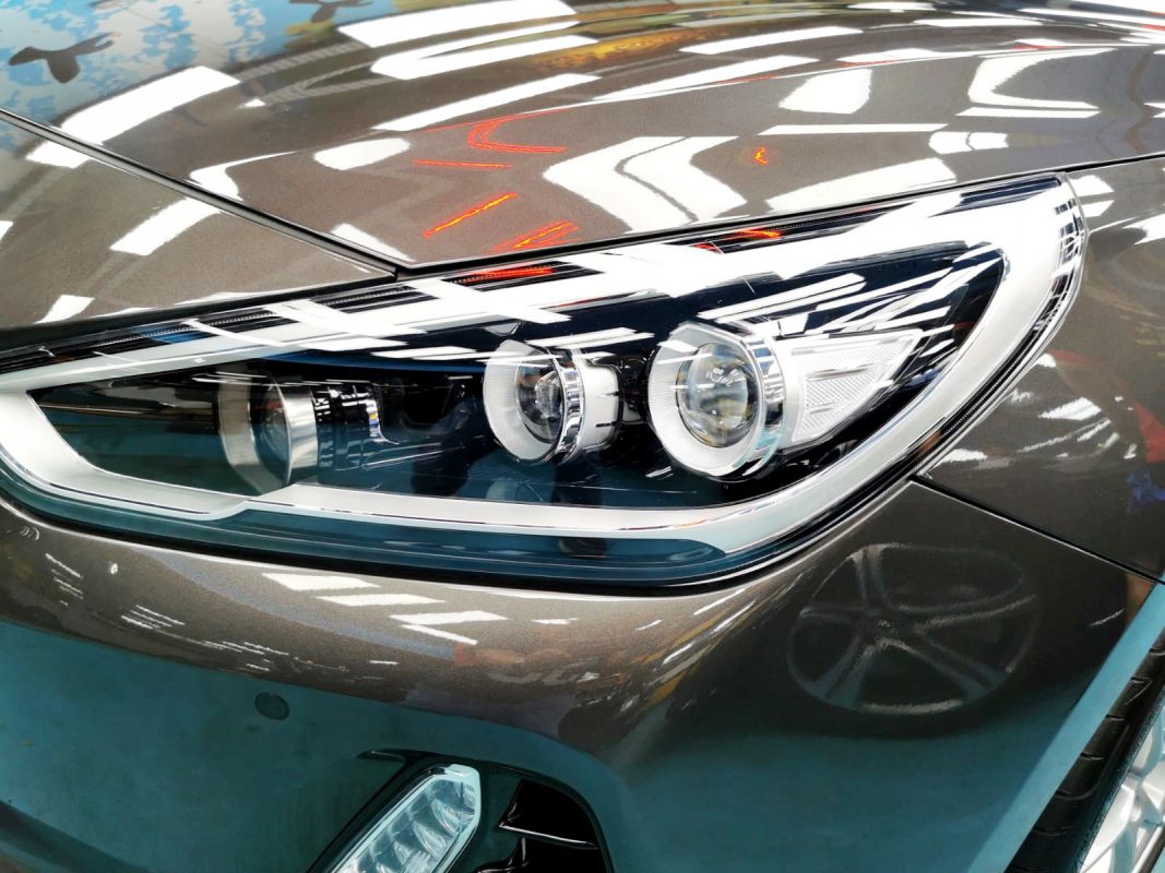 The i30's coated paintwork showing clean reflections.