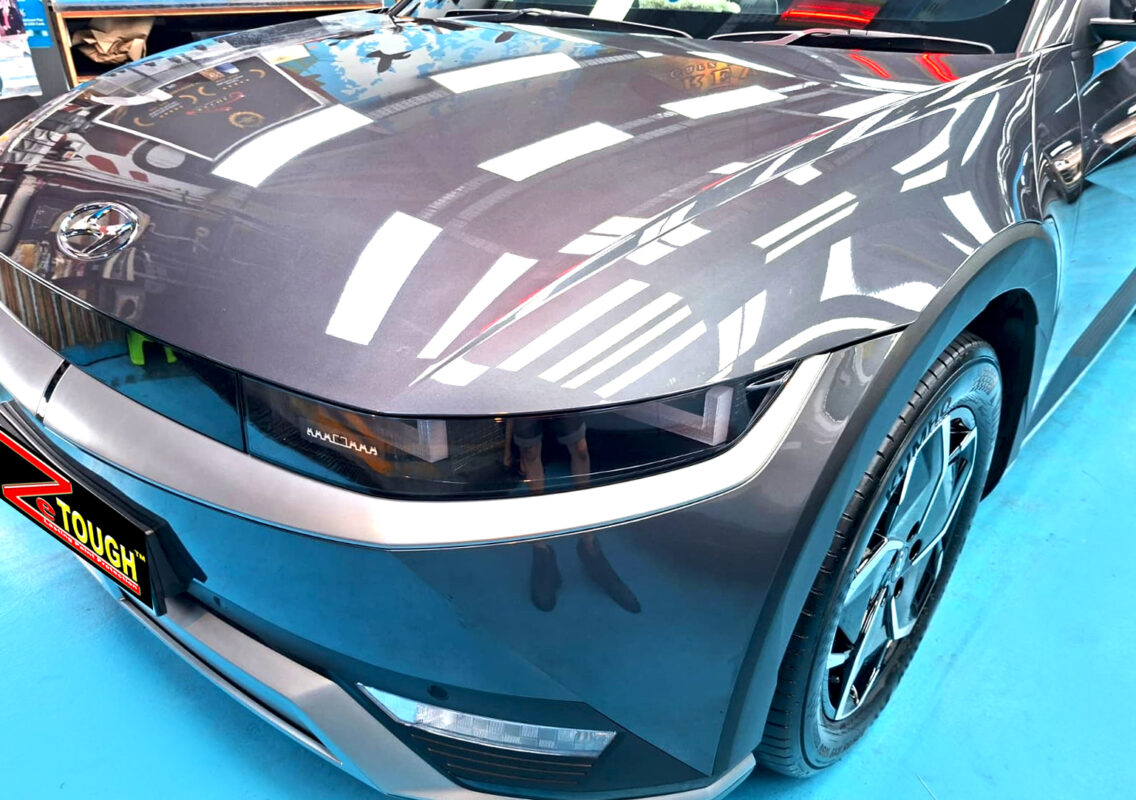 The Hyundai Ioniq 5's coated paintwork under workshop lighting.
