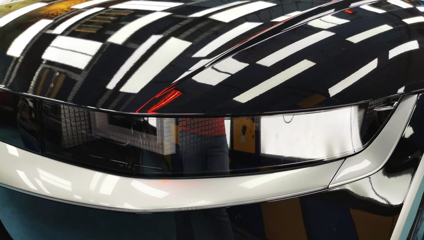 The Ioniq 5's coated paintwork showing clean reflections.