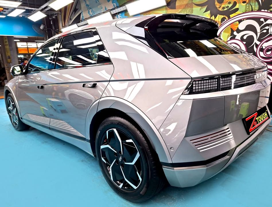 Rear three-quarter view of the Ioniq 5 with its pixel tail lights and two-tone alloy wheels.