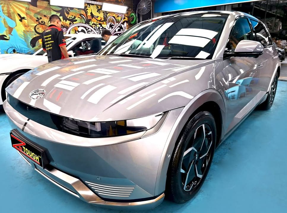 Silver Hyundai Ioniq 5 front three-quarter view in the Revol Carz workshop after ZeTough Titanium coating.