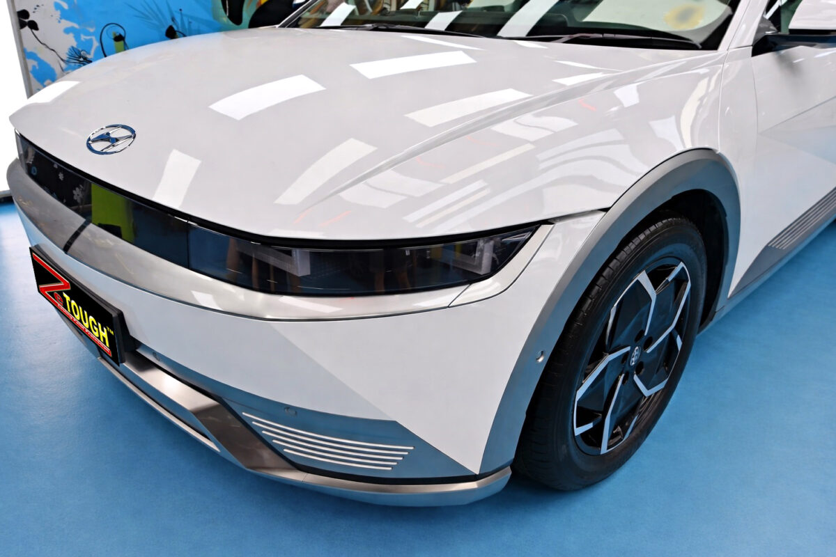The Hyundai Ioniq 5's coated paintwork under workshop lighting.