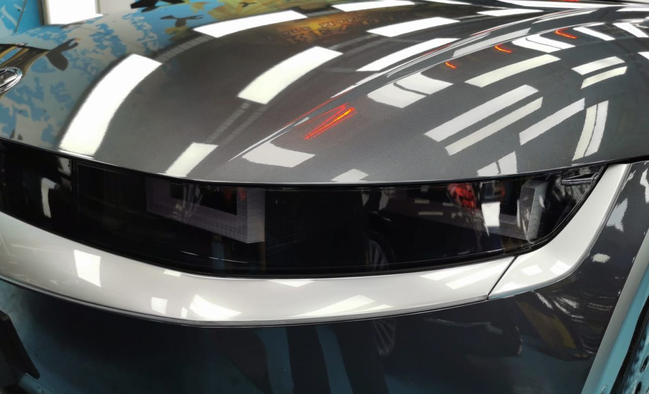 The Ioniq5's coated paintwork showing clean reflections.