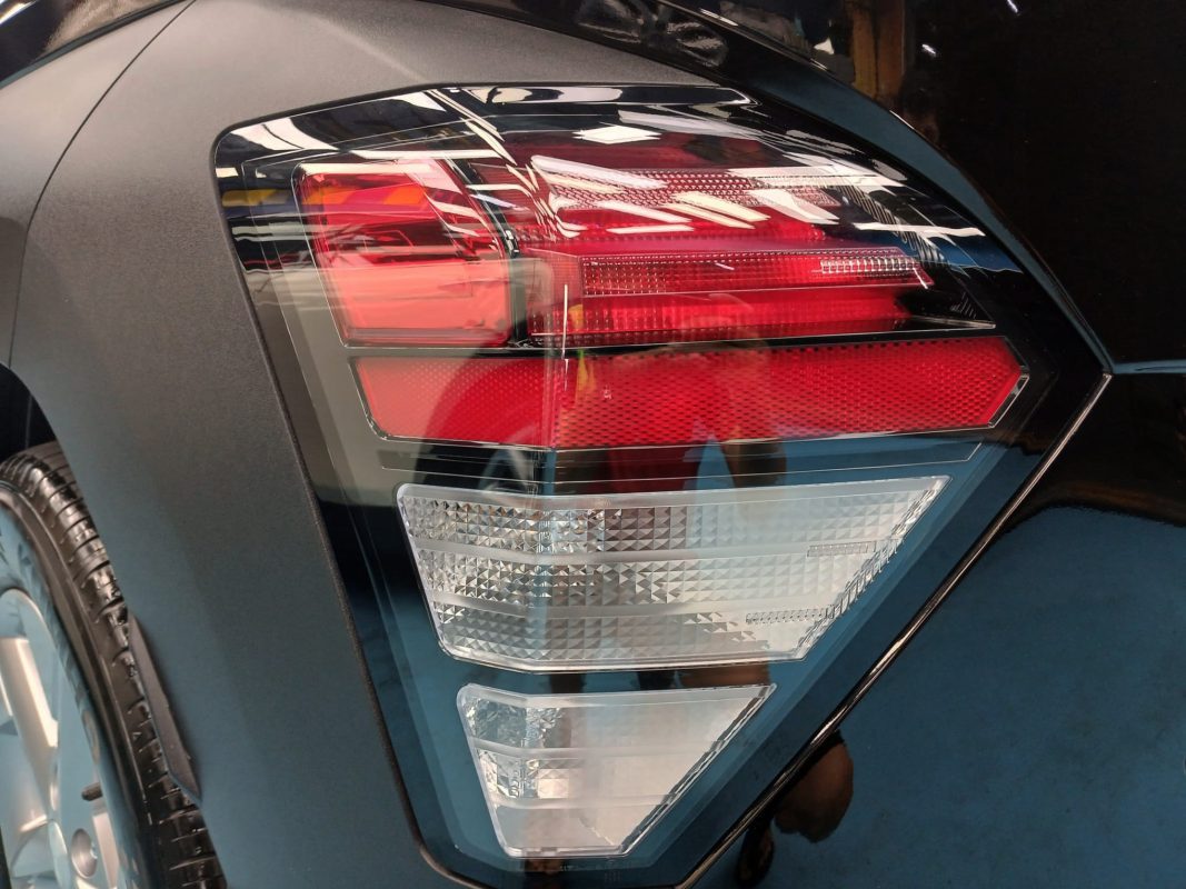 The coated bonnet of the Hyundai Kona under workshop lighting.