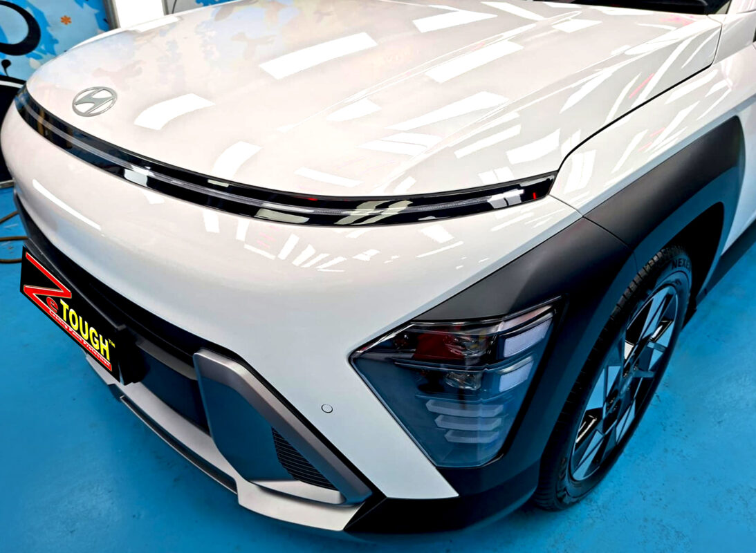 The Hyundai Kona's coated paintwork under workshop lighting.