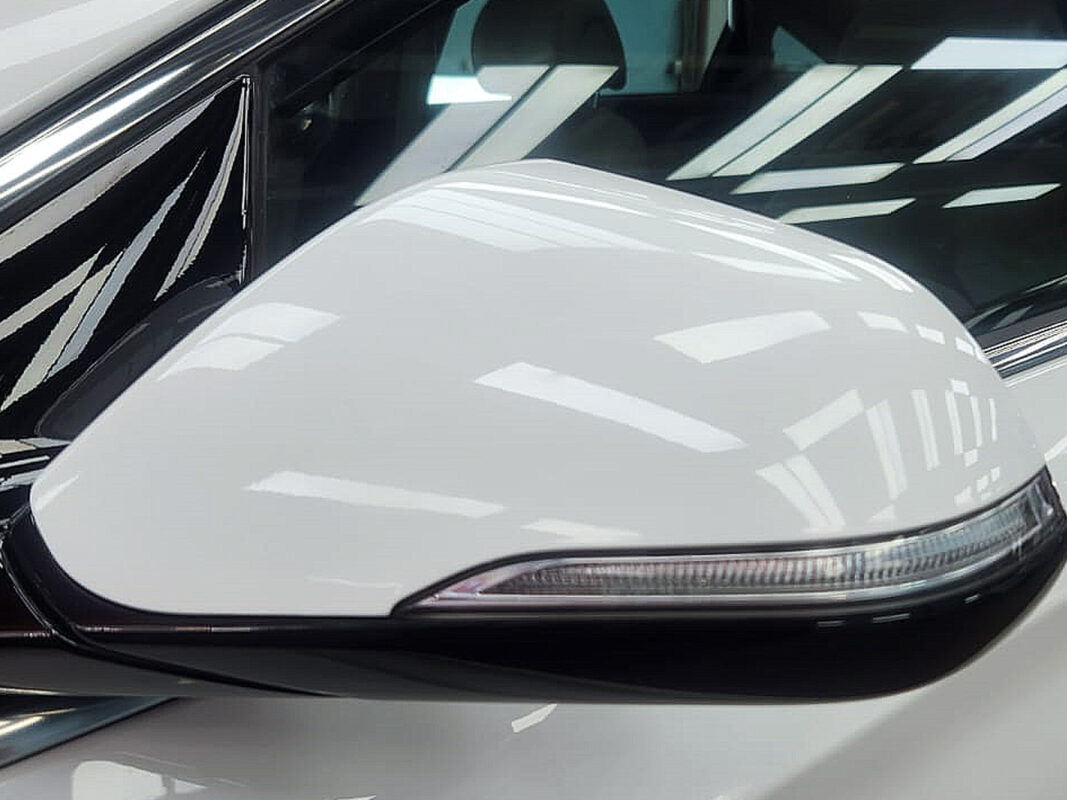 After: the same car resprayed and sealed, restored to showroom condition.