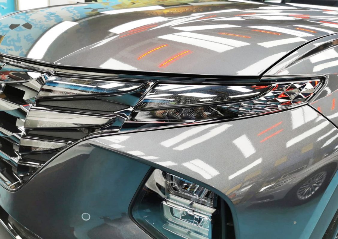 The NX4 Tucson's coated paintwork showing clean reflections.