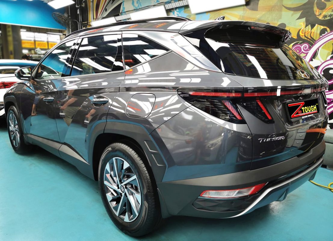 Rear quarter of the Hyundai NX4 Tucson, glossy and protected.