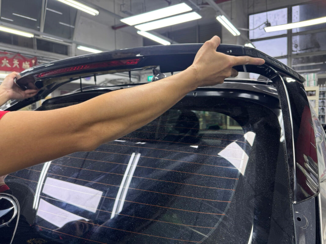 Paint application underway on the Hyundai Tucson, mid-booth.