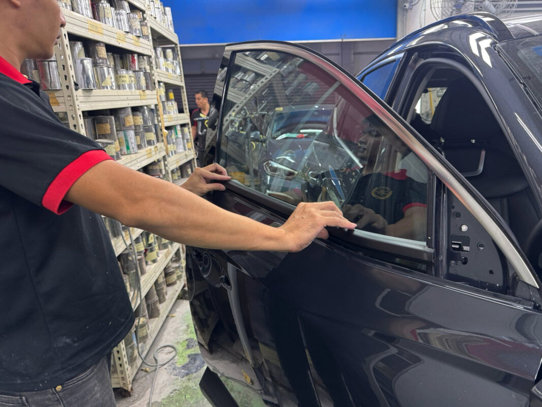 Machine-polishing the Hyundai Tucson to bring up the gloss after painting.